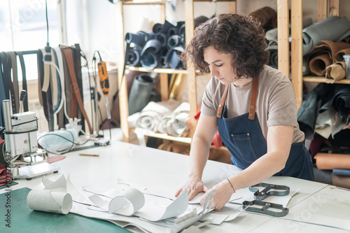 Woman tanner at work in the workshop.  photo