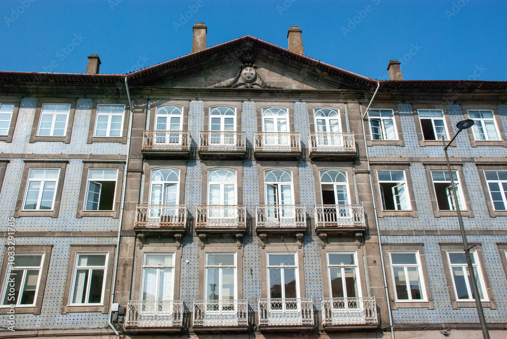 Facade of typical Portuguese house in Porto with blue azulejo tiles - Portugal Facade of typical Portuguese house in Porto with blue azulejo tiles - Portugal