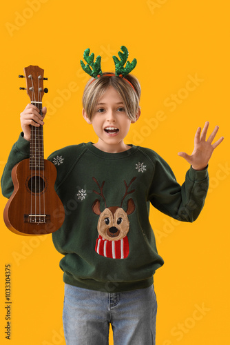 Happy young boy in reindeer...