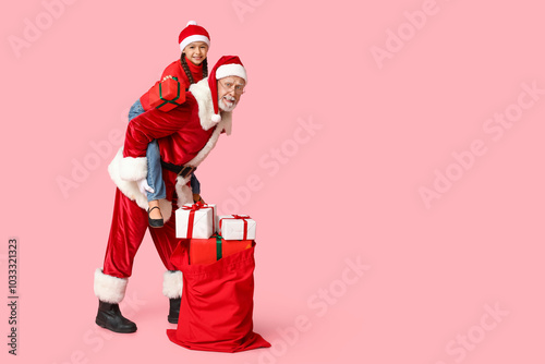 Happy santa claus piggyback...