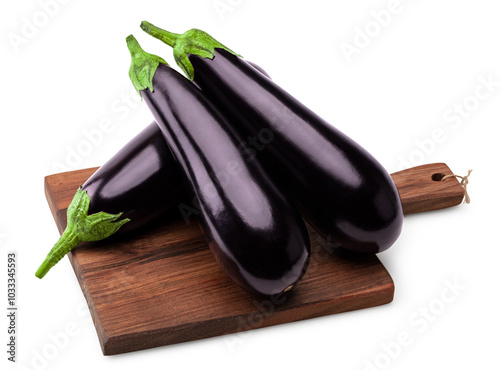 eggplants on rustic kithen wooden board isolated on white background. clipping path photo