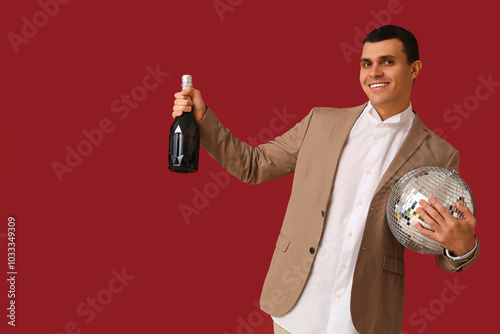 Young man with disco ball a...