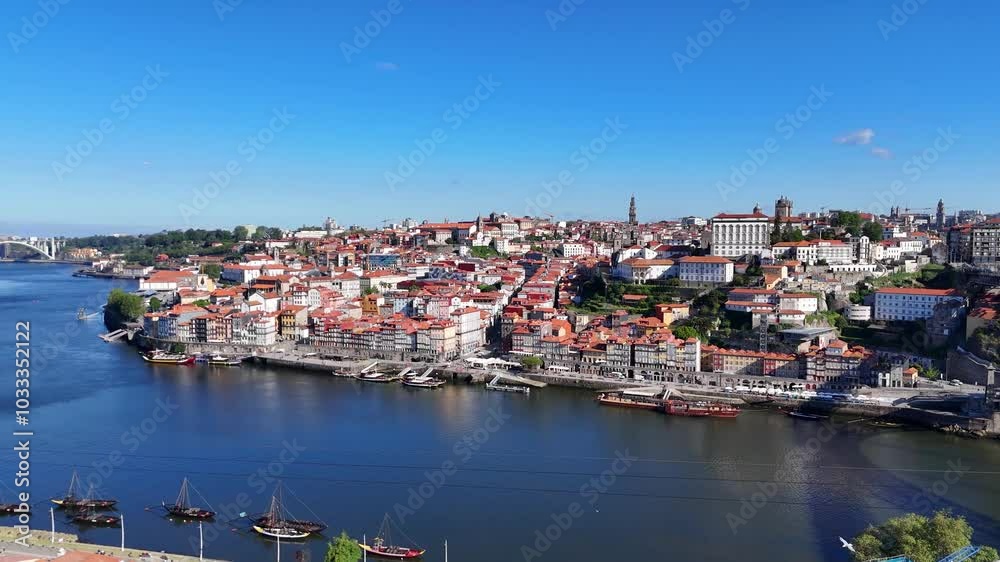 Porto, Portugal. Aerial view of the old city with promenade of the Douro river and old bridge. Porto, Portugal. Aerial view of the old city with promenade of the Douro river and old bridge.