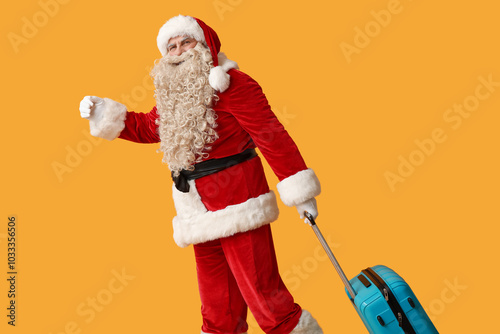 Santa Claus with suitcase a...