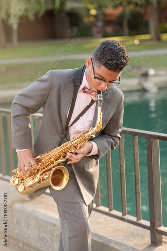 Young boy playing the saxophone photo