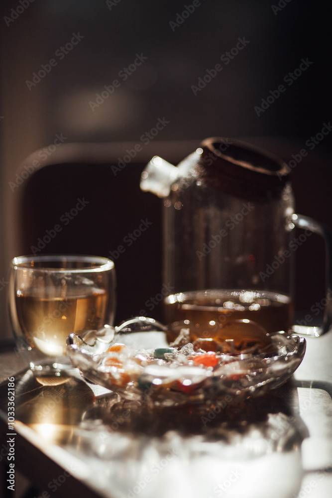 A kettle of herbal tea is on the table. A kettle of herbal tea is on the table.