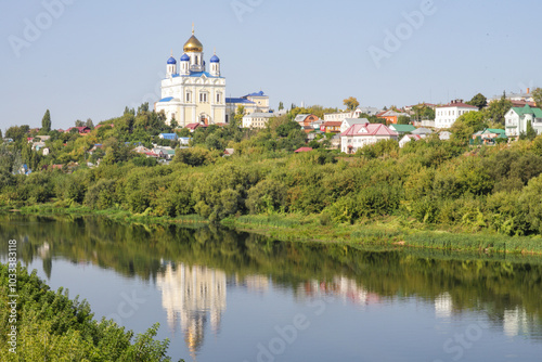 A beautiful river with a church in the background