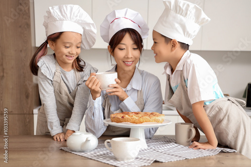 Happy asian family baking t...