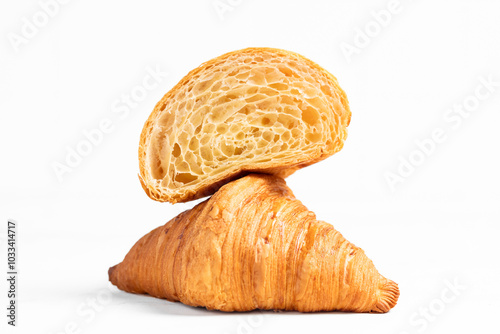 Cut in Half Croissant with Inside Texture and Thin Crisp Layers. Delicious French Pastry. Light background.