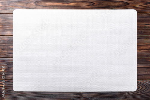 Mockup of a white textured placemat on a rustic wooden table backgroun AI-Generated. photo