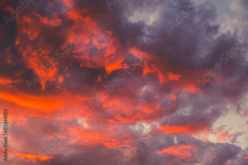 dramatic and colorful sunset clouds in summer time