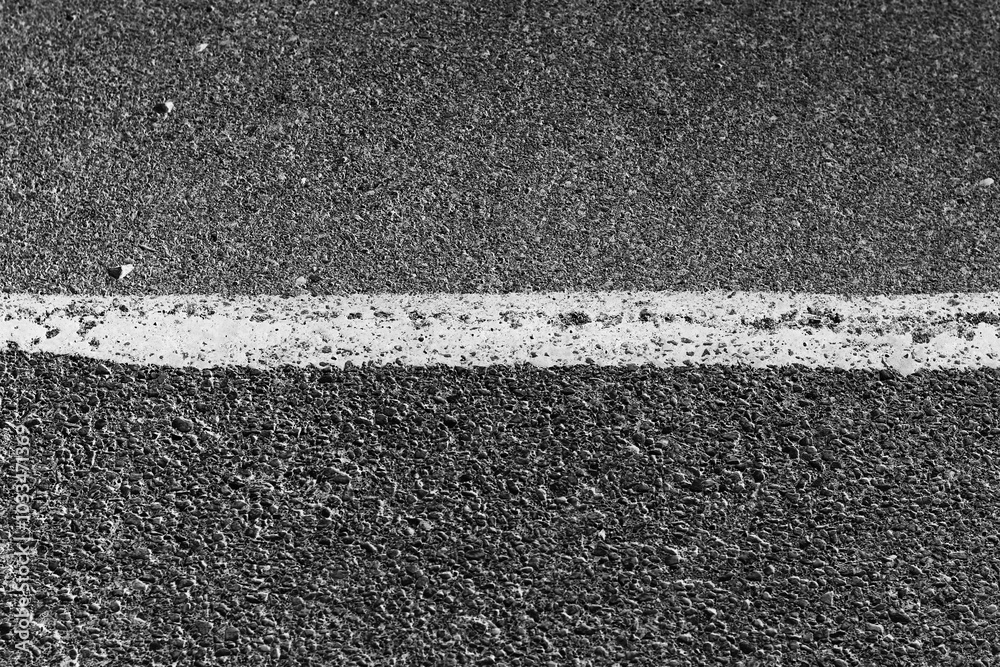 Fototapeta premium asphalt background of a white line