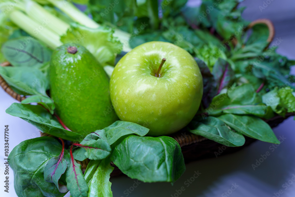 A beautiful still life consisting of a green apple ripe avocado and fresh herbs A beautiful still life consisting of a green apple ripe avocado and fresh herbs