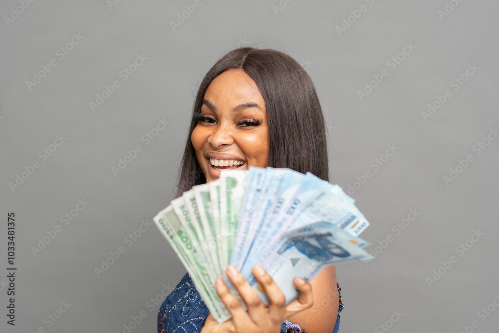 excited young african lady flaunting some cash excited young african lady flaunting some cash