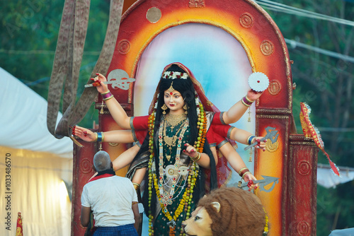 Durga Idol Before Immersion in Kund, Devotees Preparing for Durga Visarjan Ritual, Durga Idol Being Cooled Near Kund, Durga Visarjan Preparations at Kund Site, Final Ritual Before Durga Visarjan.  photo