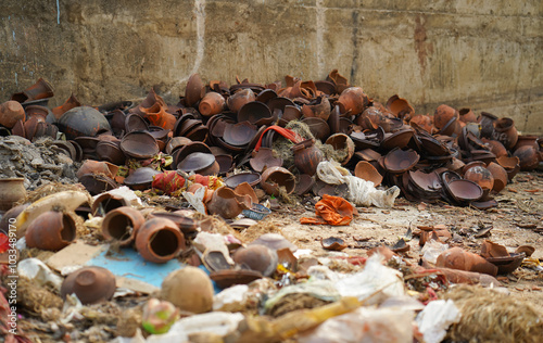 Pile of Broken Earthen Pots at Visharjan Site, Broken Clay Pots Near Durga Kund, Clay Pot Waste Near Ritual Site, Earthen Pot Remains at Durga Kund Stock Photo.


 photo