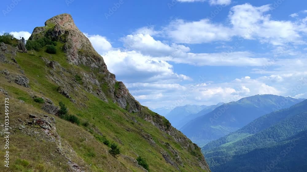 View of the mountain range near Mount Zakan. The top of the mountain node of the western part of the main ridge of the Greater Caucasus. Zakan Peak is the beginning of the Magisho mountain range. 4К View of the mountain range near Mount Zakan. The top of the mountain node of the western part of the main ridge of the Greater Caucasus. Zakan Peak is the beginning of the Magisho mountain range. 4К