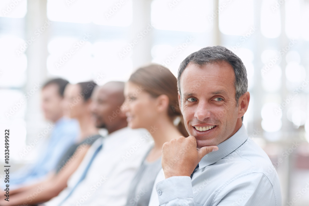 Thinking, mature and businessman in audience for workshop, seminar or learning in conference. Happy, face or daydreaming in presentation for staff training, development ideas or convention at office Thinking, mature and businessman in audience for workshop, seminar or learning in conference. Happy, face or daydreaming in presentation for staff training, development ideas or convention at office