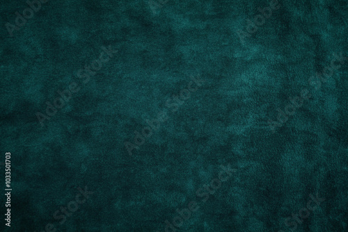 Emerald green velvet texture, close-up of smooth fabric with deep green tones and a luxurious appearance, featuring slight light reflection on the soft surface, highly detailed for textile backgrounds