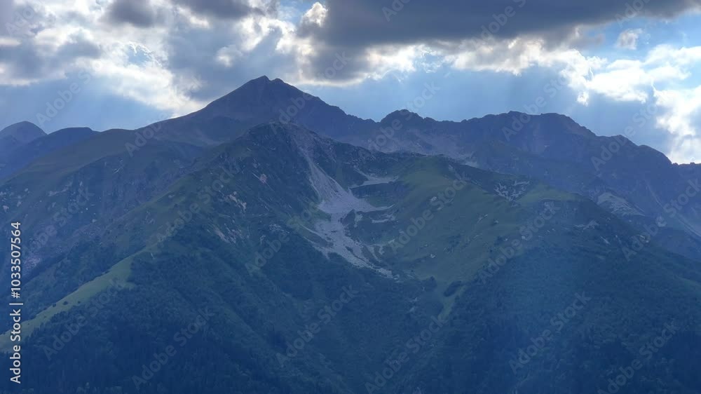 View of the mountain range near Mount Zakan. The top of the mountain node of the western part of the main ridge of the Greater Caucasus. Zakan Peak is the beginning of the Magisho mountain range. 4К View of the mountain range near Mount Zakan. The top of the mountain node of the western part of the main ridge of the Greater Caucasus. Zakan Peak is the beginning of the Magisho mountain range. 4К