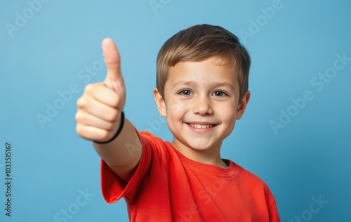 Happy child showing approval with thumbs up