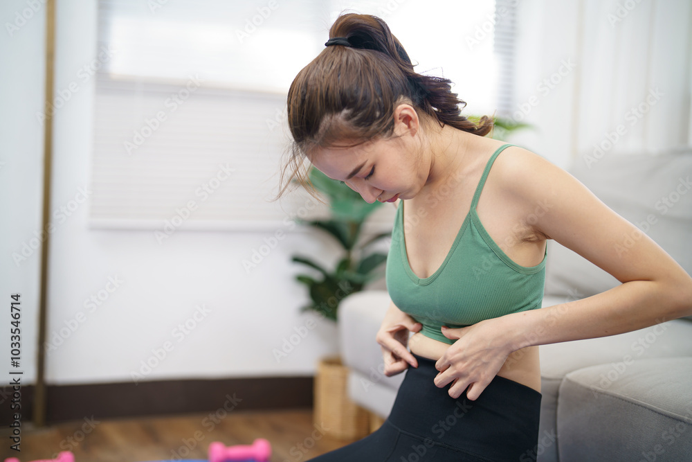 Asian woman with anorexia with measuring tape feeling unhappy. Anorexia problem body perception and dysmorphia concept Asian woman with anorexia with measuring tape feeling unhappy. Anorexia problem body perception and dysmorphia concept