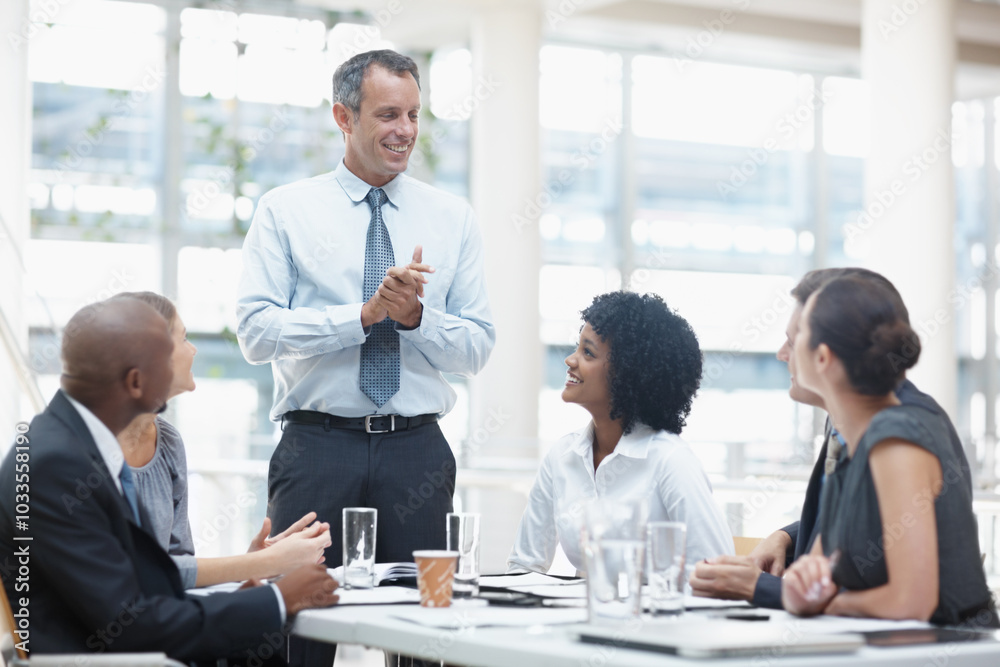 Businessman, presentation and discussion with team in meeting for corporate mission or ideas at office. Man, executive or speaker talking to group of employees for business growth or development Businessman, presentation and discussion with team in meeting for corporate mission or ideas at office. Man, executive or speaker talking to group of employees for business growth or development