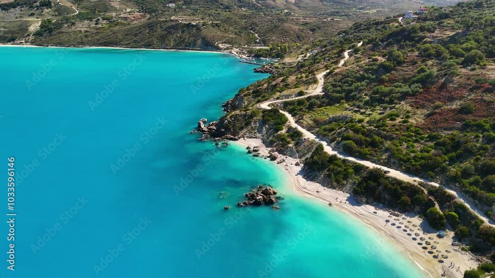 Aerial shot of Vouti Beach in Kefalonia, Greece. Fly over small white sand beach and rocky coastline in Kefalonia, Ionian islands Aerial shot of Vouti Beach in Kefalonia, Greece. Fly over small white sand beach and rocky coastline in Kefalonia, Ionian islands