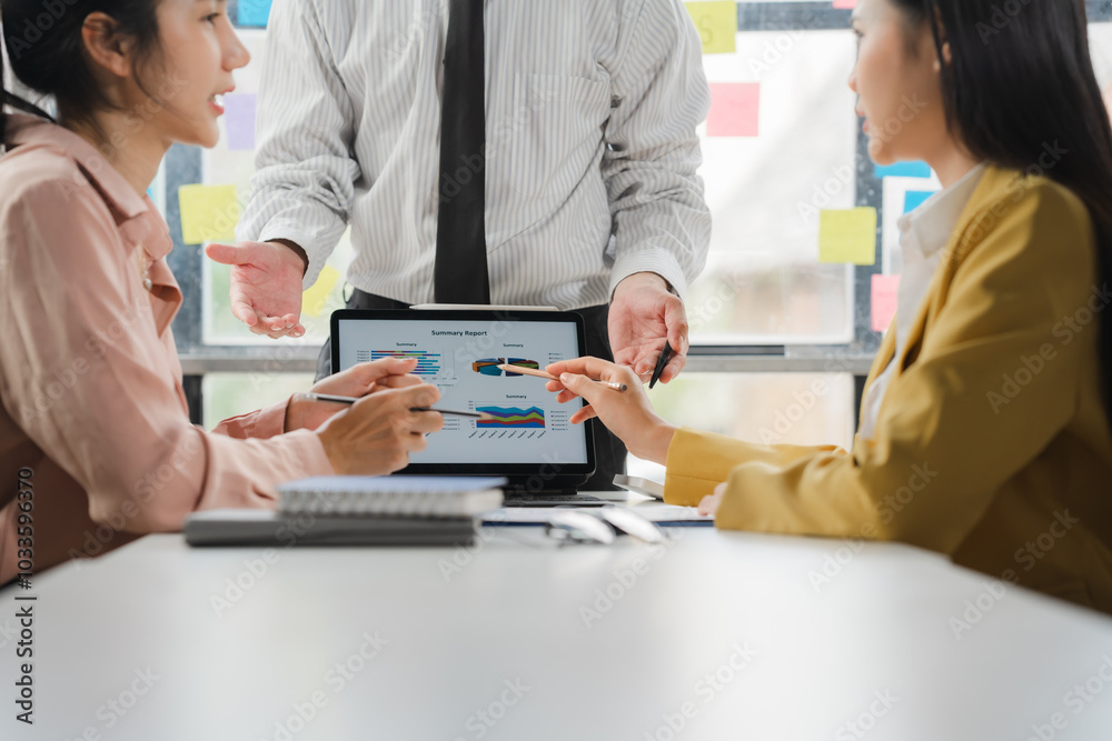 Strategic Business Meeting: Team Collaboration on Laptop Strategic Business Meeting: Team Collaboration on Laptop