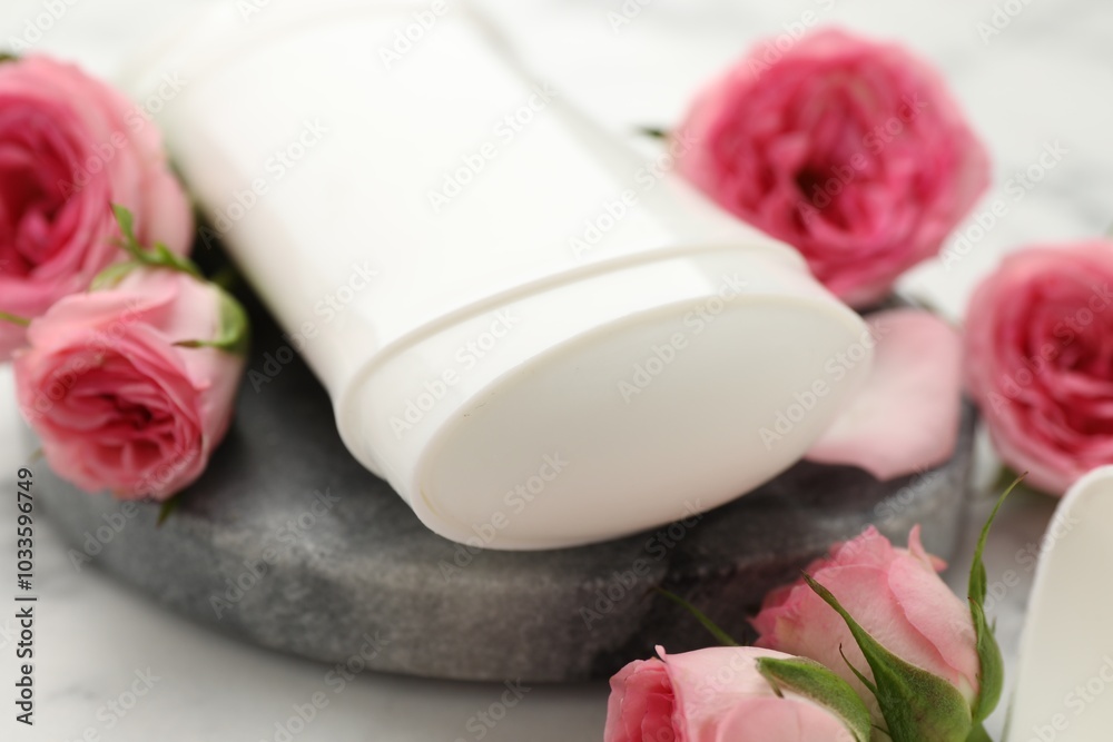 Solid deodorant and beautiful rose flowers on table, closeup Solid deodorant and beautiful rose flowers on table, closeup