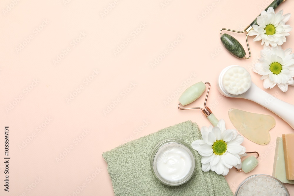 Flat lay composition with face rollers and gua sha tool on beige background, space for text Flat lay composition with face rollers and gua sha tool on beige background, space for text