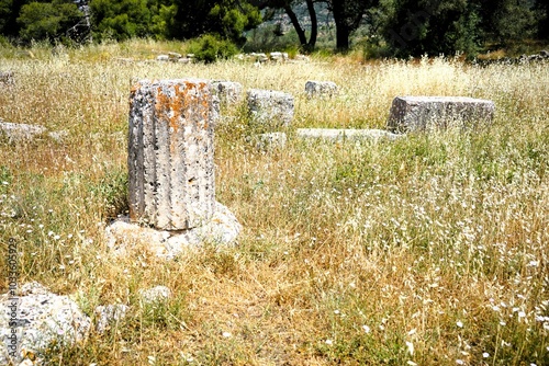 Remains of ancient columns of ancient Greek architecture at the theatre of epidaurus in Greece. Holidays and sightseeing in Greece photo