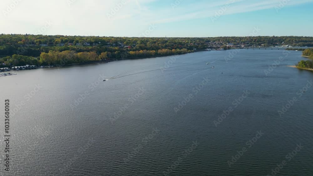 Aerial of trees turning their beautiful fall colors along a river. Aerial of trees turning their beautiful fall colors along a river.