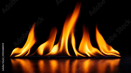 A close up of a fire flame on a black surface photo