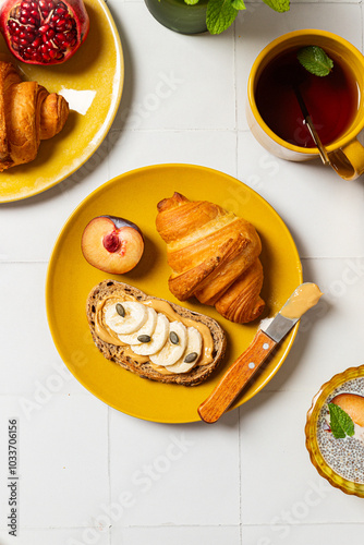 Colorful breakfast layout with pastries and fresh fruits