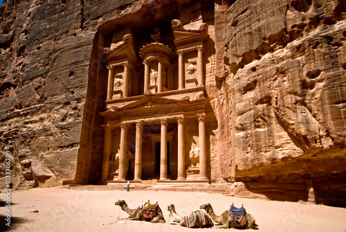 The Treasury at Petra in Jordan with camels in the foreground - travel and architecture background