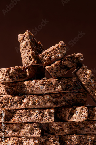 Stack of chocolate and puffed rice nougat bars close-up
