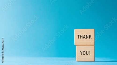 Danke dir thank you letters on wooden blocks and two shiny hearts on the light grey background, thank you card in German language