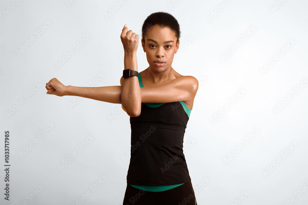 Workout. Afro Girl Doing Deltoid Arm Stretch Exercise Standing Over Yellow Background. Studio Shot Workout. Afro Girl Doing Deltoid Arm Stretch Exercise Standing Over Yellow Background. Studio Shot