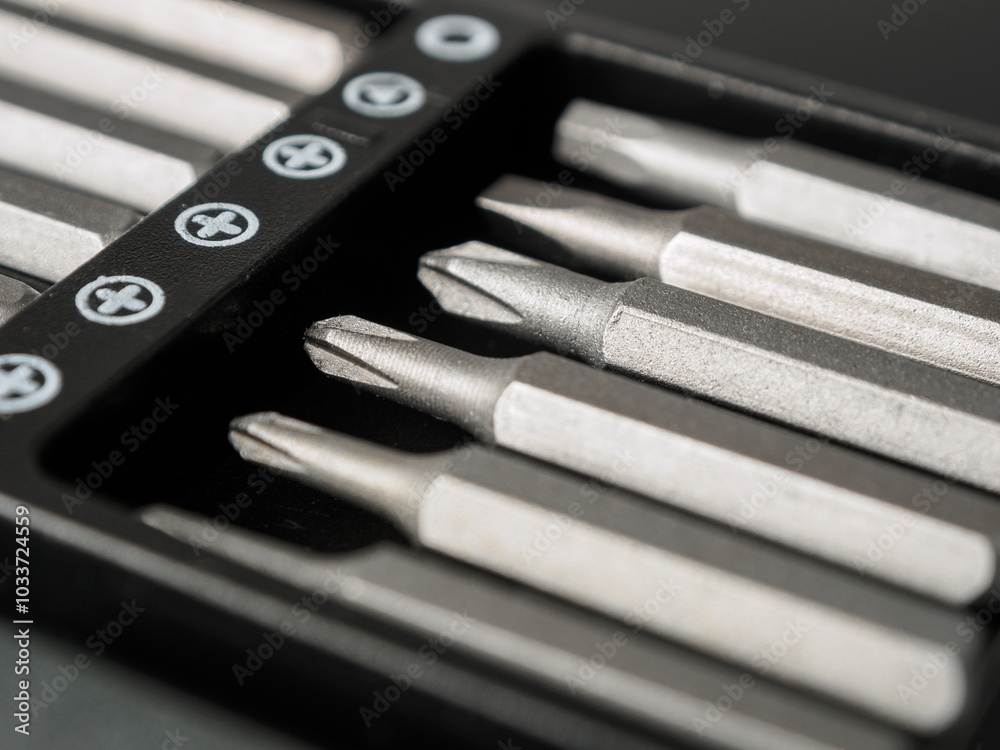 Close-up of various screwdriver heads (bits) ideal for repairing and assembling electronics and appliances Close-up of various screwdriver heads (bits) ideal for repairing and assembling electronics and appliances