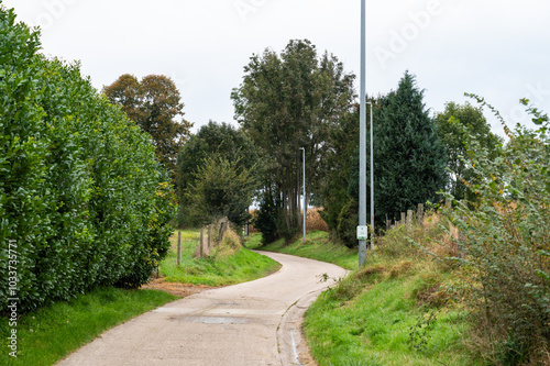 Bending country road through the countryside in the village of Willebringen, Boutersem, Belgium photo