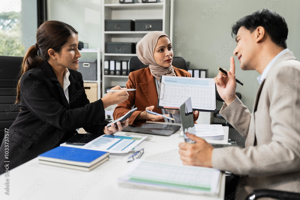 Group of diverse business people discussing a project in a meeting for analysis graph company financial. Group of diverse business people discussing a project in a meeting for analysis graph company financial.