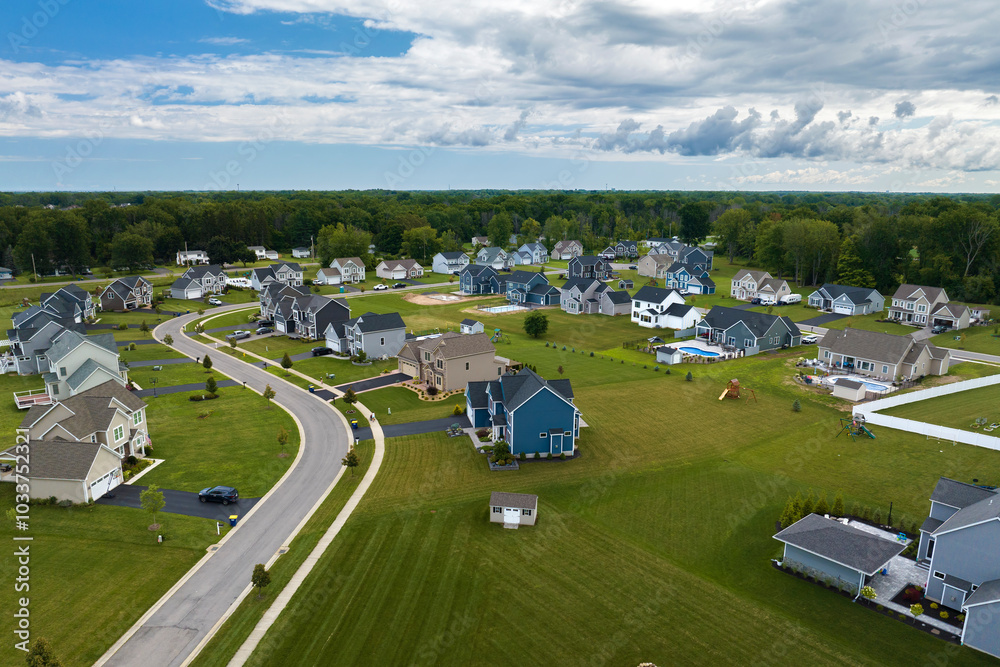 Aerial view of spacious new family houses in upstate New York suburban area. Real estate development in american suburbs Aerial view of spacious new family houses in upstate New York suburban area. Real estate development in american suburbs