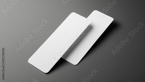 Minimalist bookmark mockup showing a classic, rectangular bookmark in a neutral setting. Great for use in digital or print media presentations, focusing solely on the bookmark design photo