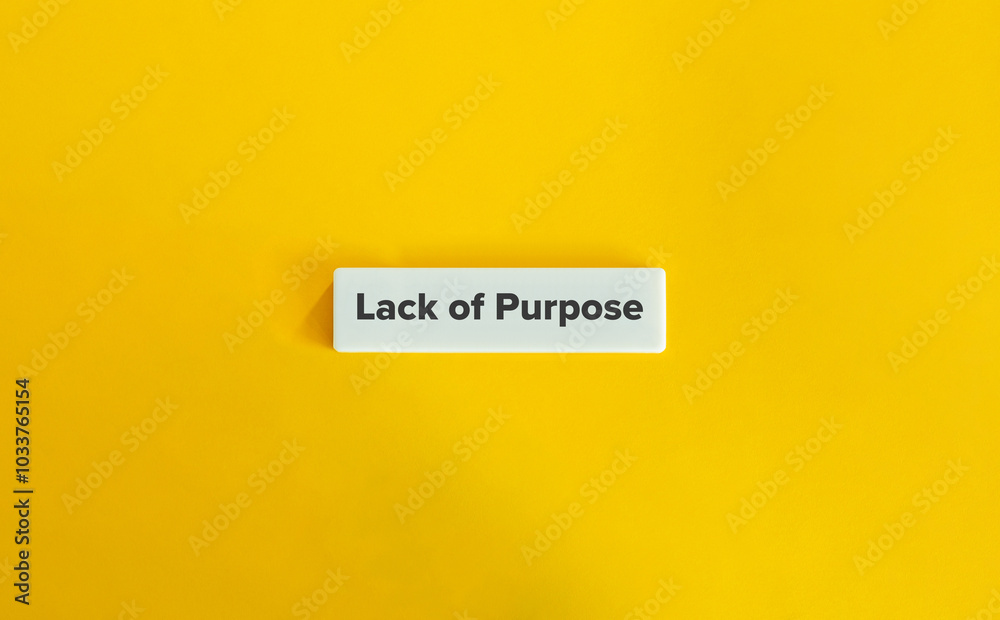 Lack of Purpose. Text on Block Letter Tile on Yellow Background. Minimal Aesthetic.