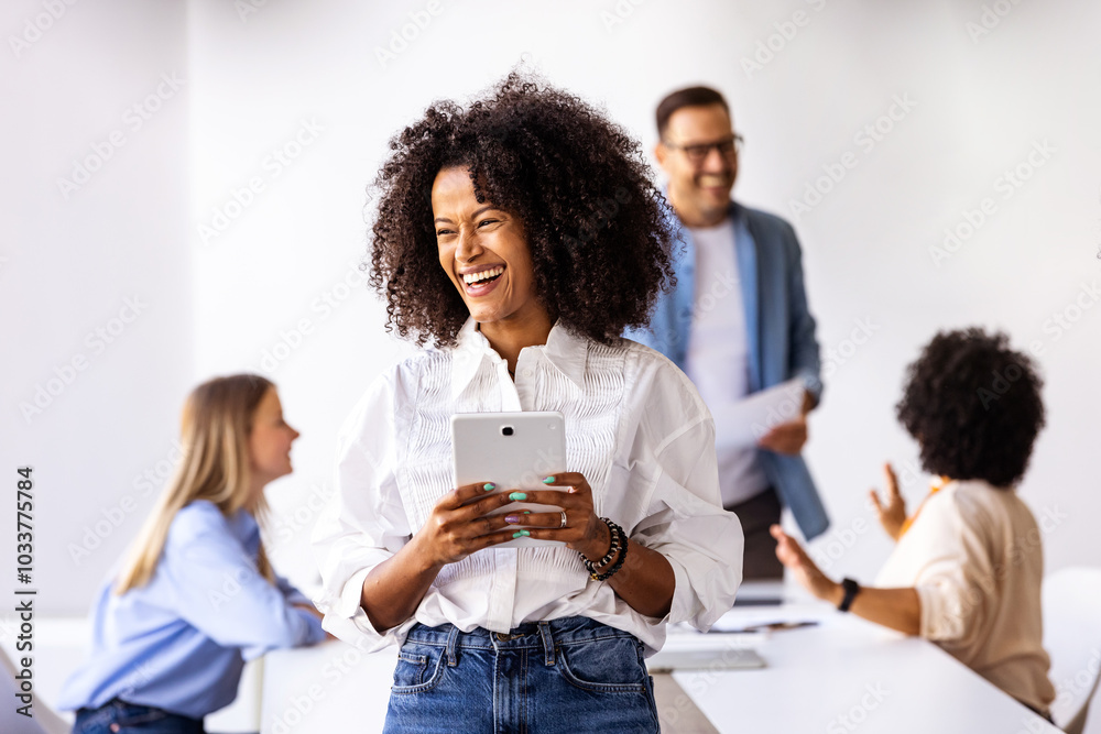 Diverse Business Team Working Together in a Bright Office Diverse Business Team Working Together in a Bright Office