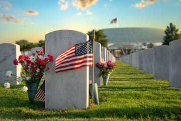 Memorial Day concept. Sarasota National Cemetery with rows of white tomb stones with USA flags and flowers