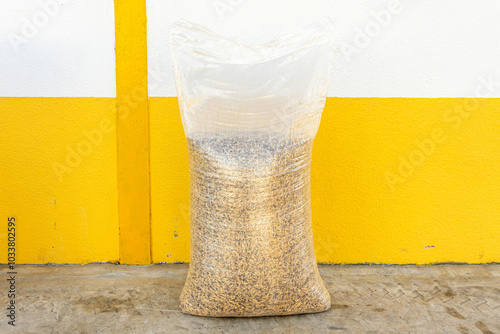 A 30 kg sack of animal feed oats, showcasing a natural grain texture. Ideal for agriculture, farming, or animal nutrition-related themes.