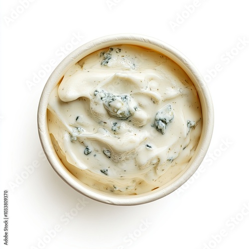 Top view of a paper cup with blue cheese dressing isolated on white background