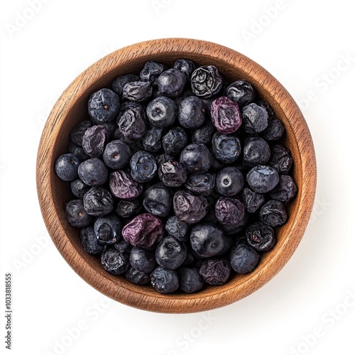 Top view of a wooden bowl filled with dried blueberries isolated on white background